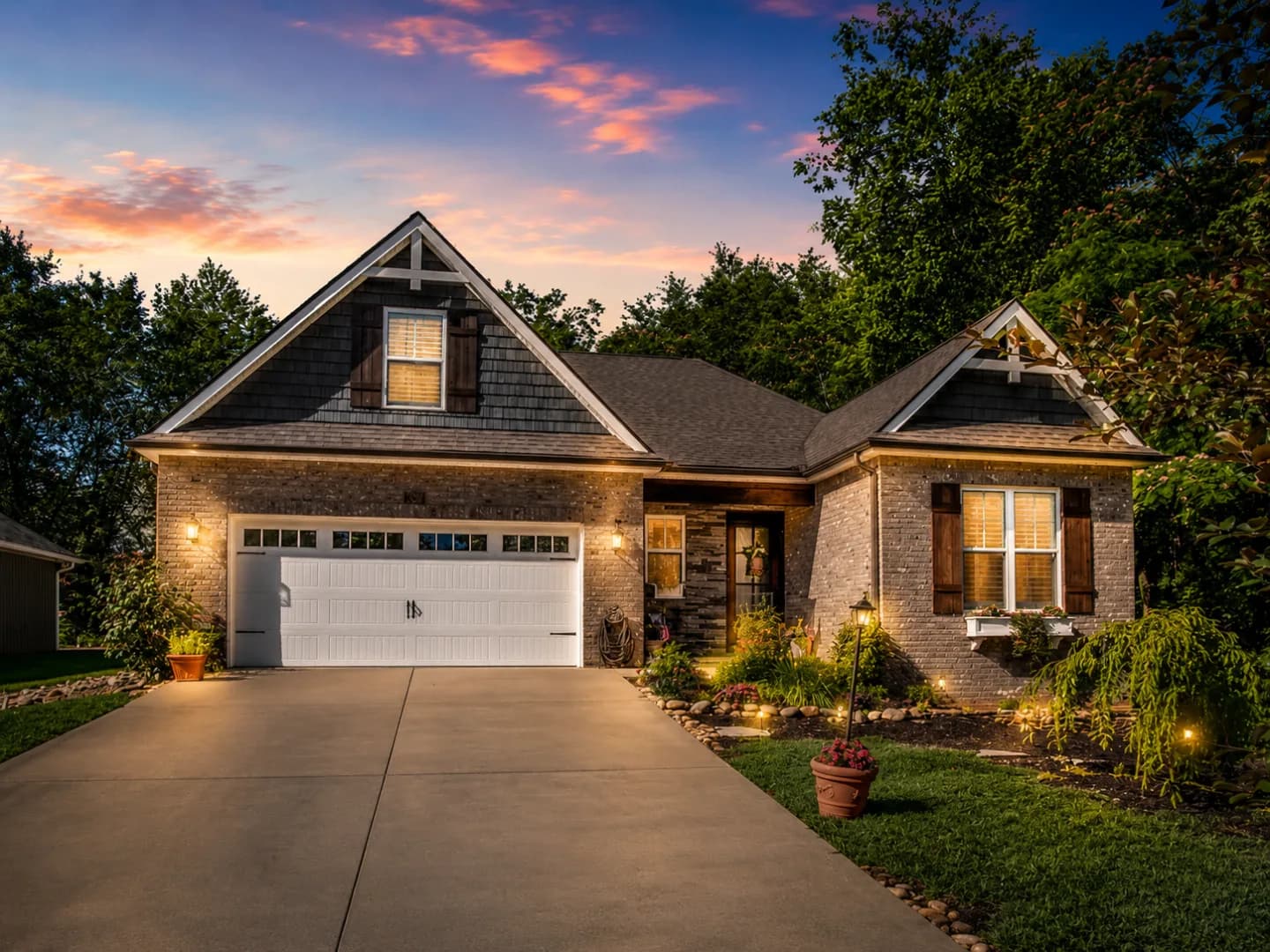 Recently completed single-family home on one of our sites, seen from the street at dusk